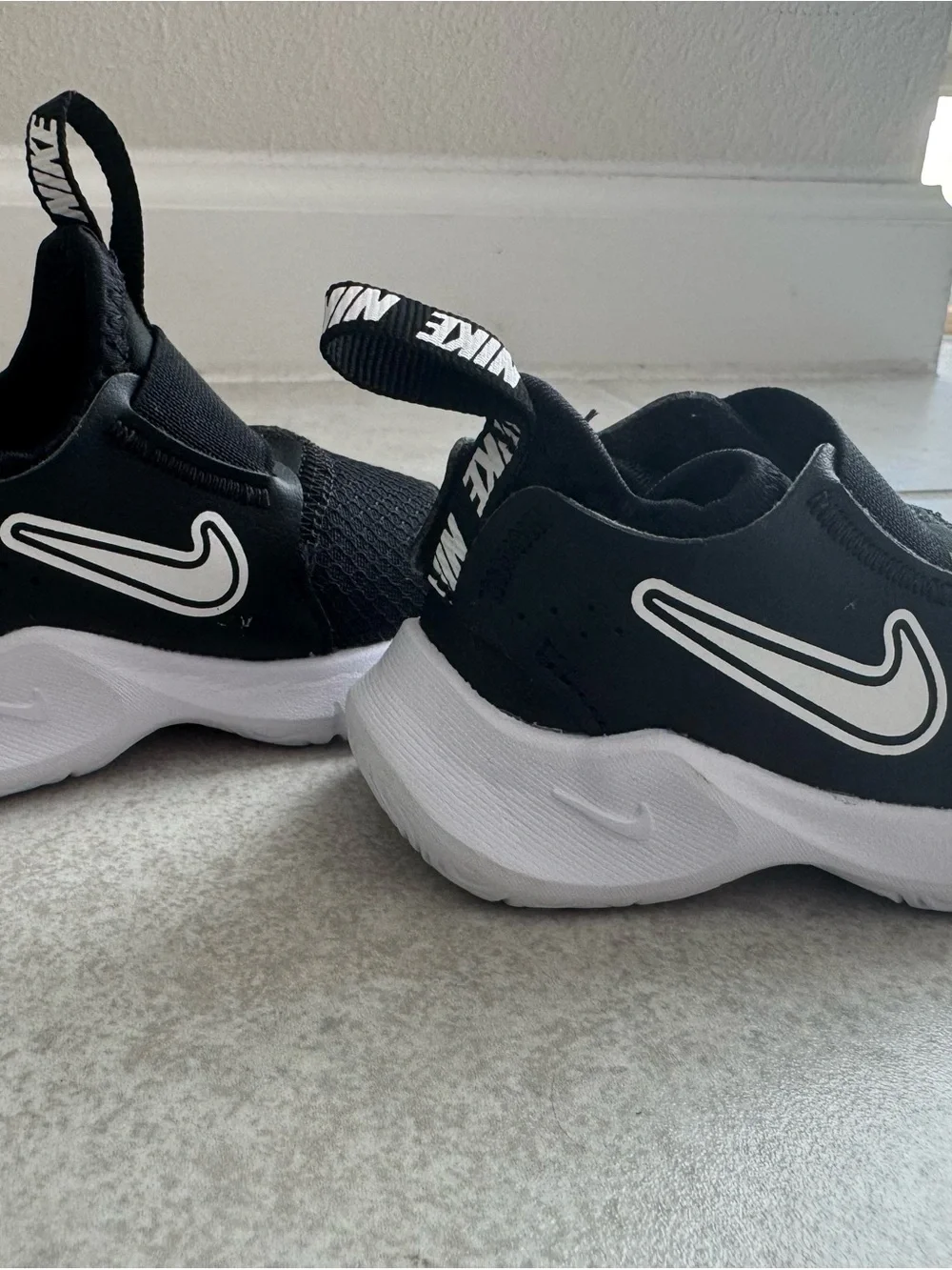 Nike Black & White Kids Slip-On Sneakers